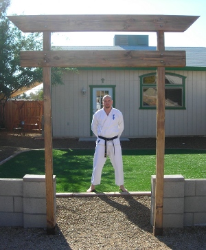 Sensei in front of his dojo