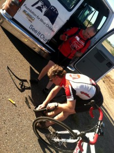 Gene changing a tire